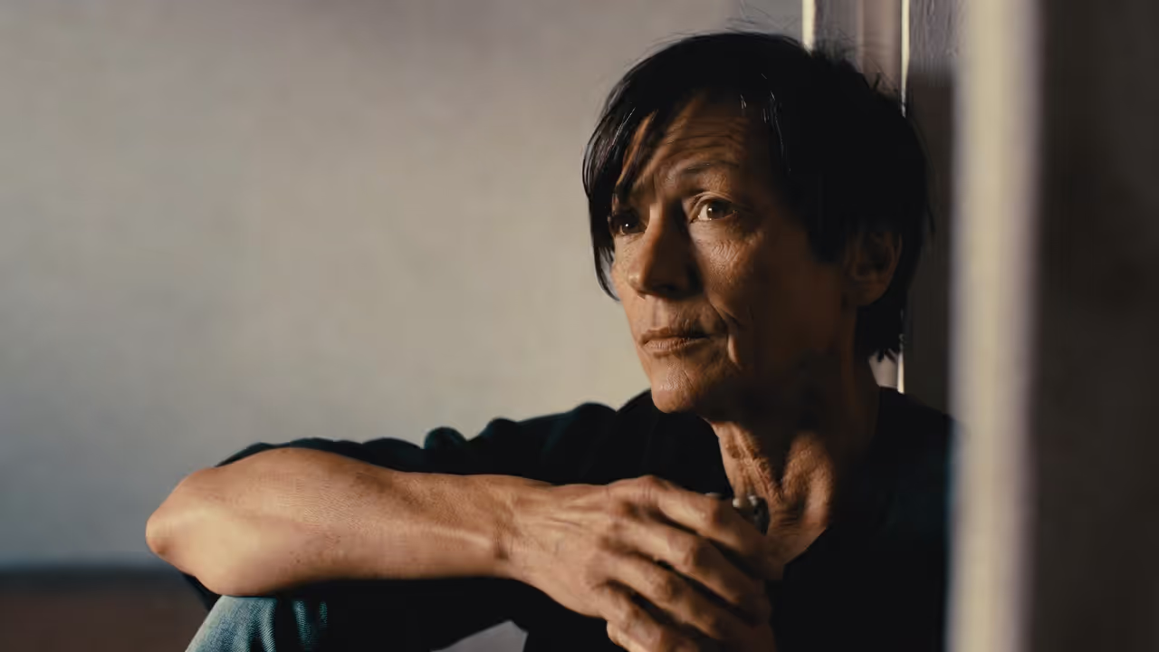 Adult indoors considering reaching out for mental health help